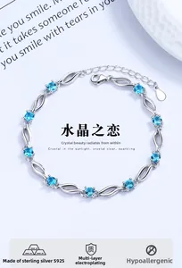 Detail of S925 sterling silver bracelet with blue crystals and lobster clasp closure