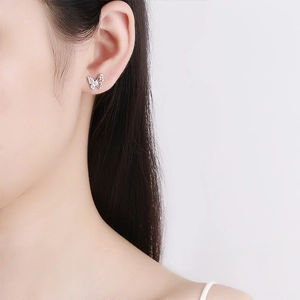 925 Sterling silver butterfly screw back stud earring with cubic zirconia on model ear