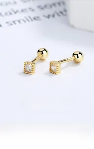 Macro shot of 18K gold S925 sterling silver square zircon screw-back stud earrings
