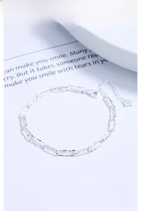 Detail of 925 sterling silver chain bracelet with lobster clasp and heart pendant