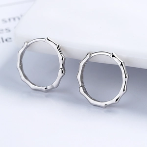 Minimalist 925 sterling silver bamboo joint hoop earrings with polished metallic finish