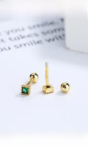 Macro detail of S925 sterling silver screw back earrings with square emerald zircon