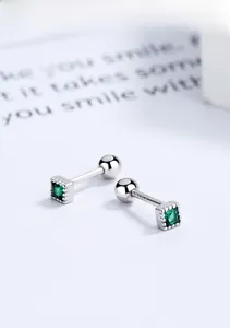 Macro detail of S925 sterling silver square emerald stud earrings with screw back design