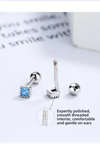 Detail view of square blue zircon S925 silver stud earrings with smooth screw back design