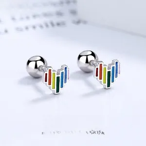 Macro shot of 925 silver heart stud earrings with rainbow enamel and screw back closures