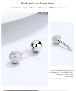Macro shot of S925 sterling silver screw back earrings showing frosted finish and hallmark