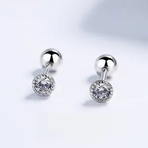 Close-up of 925 sterling silver stud earring with clear zircon and screw-back ball closure