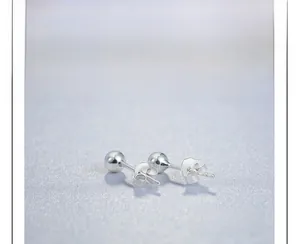 Macro shot of S925 sterling silver ball earrings with detailed auspicious cloud backings