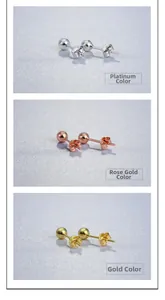 Three pairs of classic ball stud earrings in white gold, rose gold, and yellow gold finish