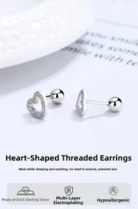 Macro detail of S925 sterling silver heart earrings with white cubic zirconia and screw back