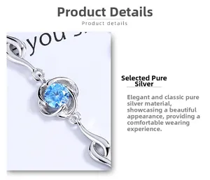 Detail of S925 sterling silver bracelet with a blue round crystal in flower setting