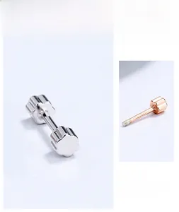 Macro detail of S925 sterling silver screw back stud earrings in silver and rose gold