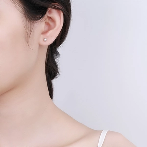 Classic 925 sterling silver screw back stud earring with tiny round zircon on ear