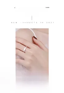 Detail of twisted 925 silver ring featuring a smooth rectangular plate and woven texture