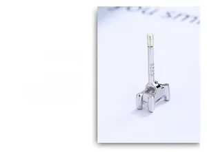 Macro shot of S925 sterling silver rectangular stud earrings with screw-back detail