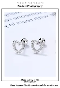 Detail of S925 sterling silver heart stud earrings with cubic zirconia and screw back ball