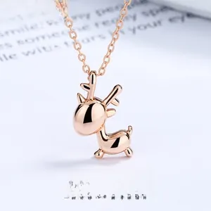 Detailed macro view of a rose gold hollow deer pendant necklace with polished finish