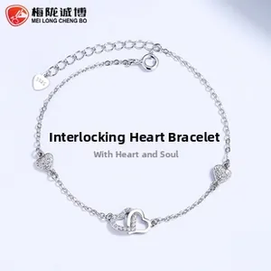 Detailed macro shot of S925 sterling silver hallmark on intertwined heart bracelet link