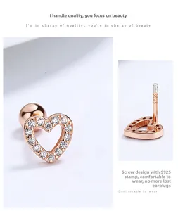 Detail of rose gold S925 silver heart stud earrings with cubic zirconia and screw back