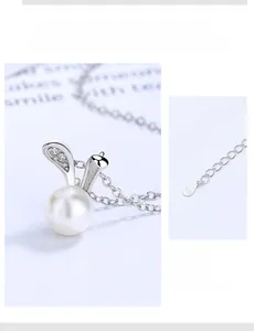 Macro detail of S925 sterling silver bunny pendant with pearl and 5cm extension chain