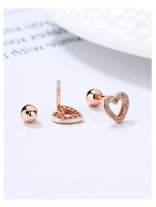Macro shot of rose gold S925 silver heart stud earrings with white zircon and screw back
