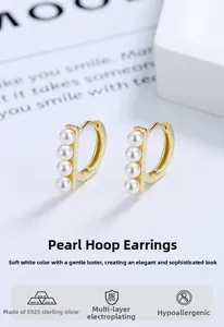 Detailed macro of gold S925 sterling silver earrings with four vertical shell pearls