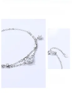 Detail view of the adjustable S925 sterling silver star moon bracelet with clear crystals