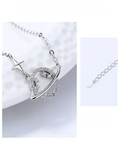 Macro detail of S925 sterling silver Saturn pendant with crystals and adjustable chain