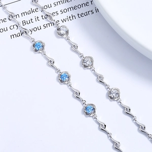 S925 sterling silver four-leaf clover bracelet with blue heart crystal and wavy link design