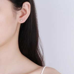 Minimalist 925 sterling silver geometric rectangular stud earring with clear stone on ear