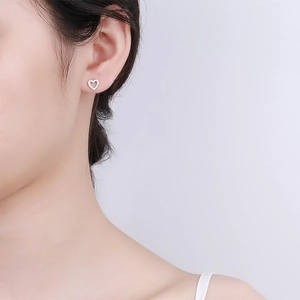 Elegant S925 sterling silver heart stud earrings with sparkling zircon stones for women