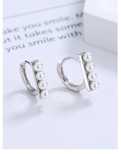Detailed view of silver hoop earrings featuring four vertical pearls on S925 silver band