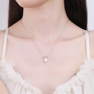 925 silver bunny pearl necklace shown on a model for a delicate minimalist jewelry look