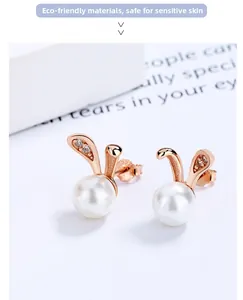 Detail of rose gold bunny pearl earrings with sparkling micro-zirconia stone accents