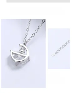 Détail macro du collier en argent 925 montrant le poinçon S925 et la chaîne réglable de 5 cm