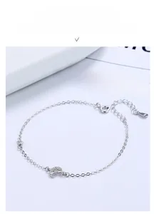 Macro shot of S925 sterling silver crescent moon bracelet with micro-pave cubic zirconia