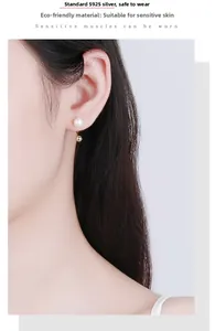 Detail of s925 silver U-shape earring with pearl on model for sensitive ears