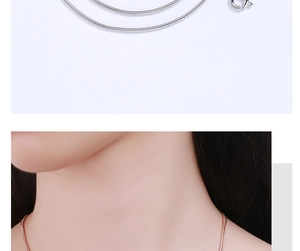 Detail view of 1mm S925 sterling silver snake chain necklaces in silver and rose gold