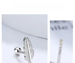 Macro shot of 925 sterling silver feather earring with secure screw-back ball closure