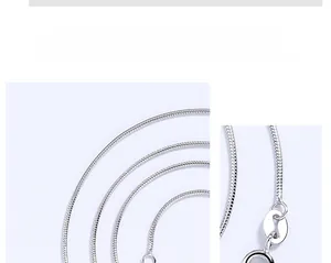 Detailed macro view of 1mm silver snake chain showing the texture and spring clasp