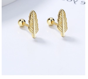 Macro shot of 925 silver feather earrings with detailed texture and spiral screw back