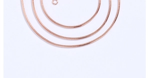Macro shot of 1mm rose gold snake chain showing smooth round textures and metallic finish