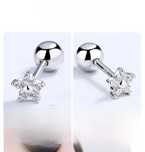 Macro shot of S925 sterling silver star stud earrings with zircon inlay detail