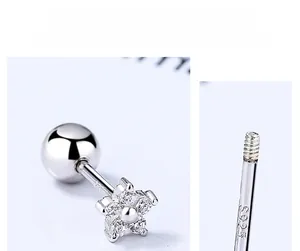 Close-up of S925 sterling silver star flower earring with sparkling zircon stones