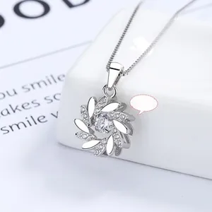 Detailed view of 925 silver sunflower necklace featuring a dancing center stone