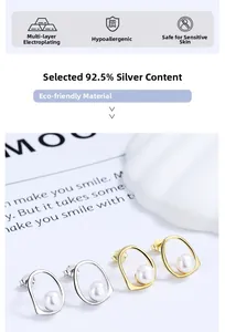 Detailed view of silver and gold irregular geometric S925 sterling silver pearl earrings