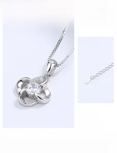 Detailed macro shot of S925 sterling silver four-leaf clover pendant and 5cm extension chain