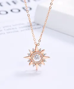 Close-up of rose gold sterling silver necklace with a dancing star pendant and tiny crystals