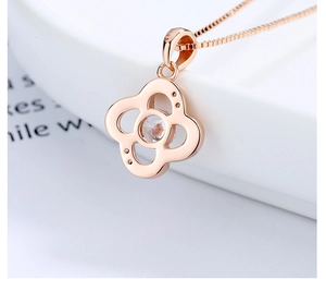Detailed close-up of rose gold S925 sterling silver clover necklace with zircon inlay