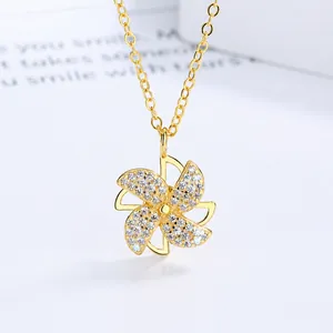 Élégant collier moulin à vent à quatre feuilles rotatif doré orné de zircons brillants
